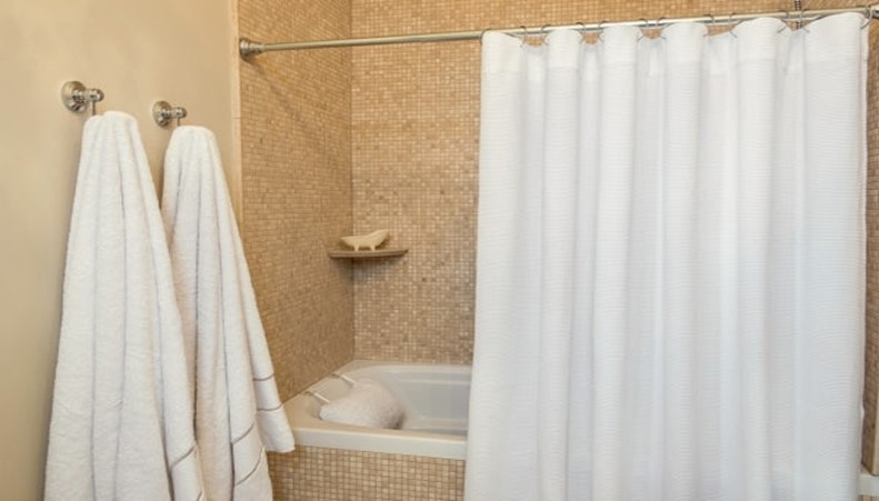 Straight shower curtain rod — limited shower space